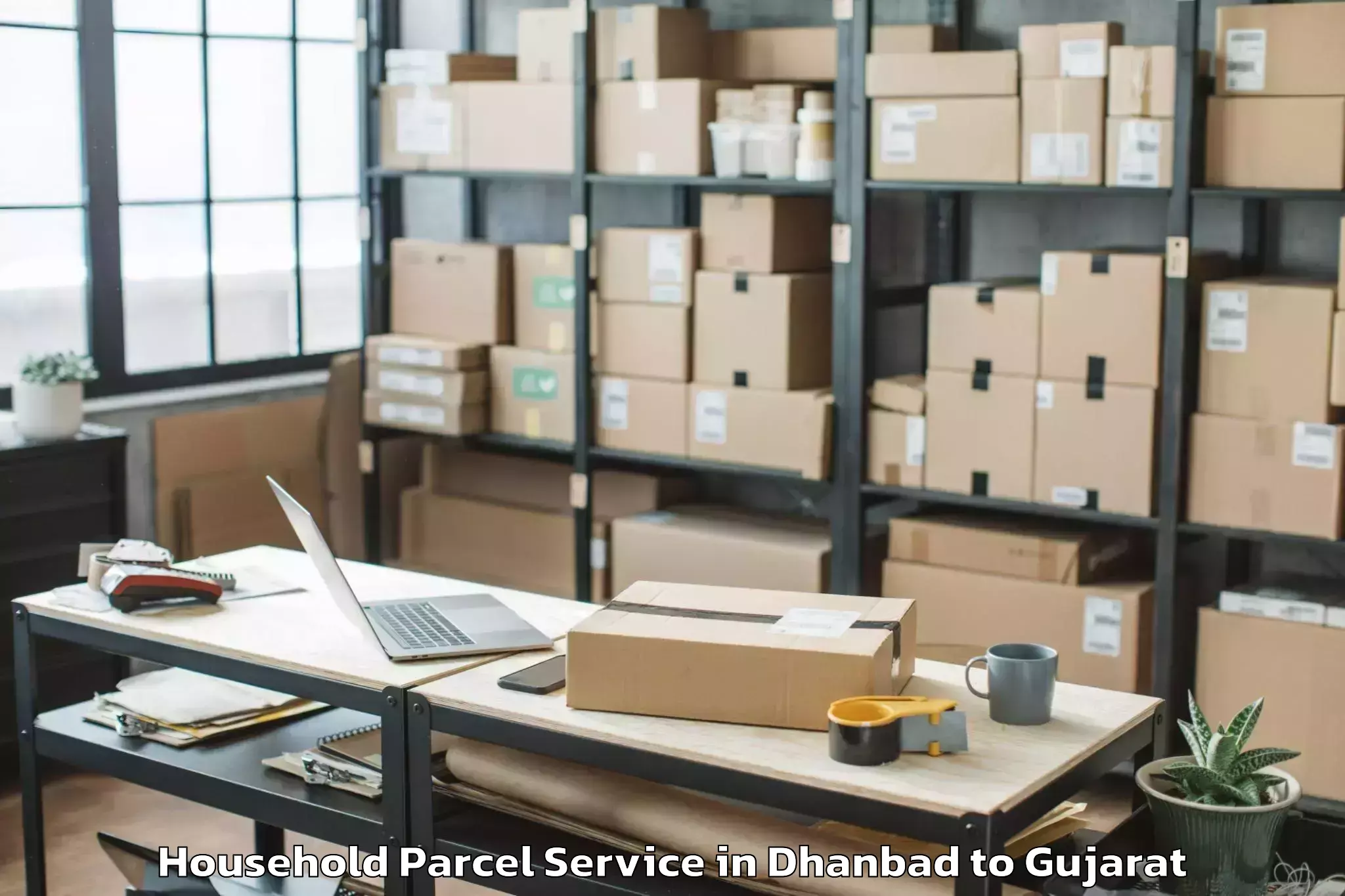 Book Your Dhanbad to Madhavpur Household Parcel Today